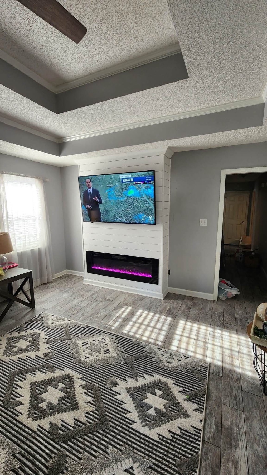 Shiplap media wall with recessed electric fireplace